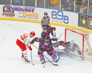 Youngstown Phantom #72, Liam Dennison, and #5, Jason Smallidge, stop Dubuque Fighting Saints #15, Dalton Hunter, from putting the puck in the net during the second game of the USHL playoff at the Covelli Center on Saturday, April 21, 2018.  

Photo by Scott Williams - The Vindicator.