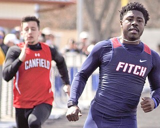 Ralph Fitzgerald of Austintown Fitch runs away from the field in the Division I 100 at the Mahoning County Track and Field Championships on Saturday at Fitch High School. Fitzgerald helped the Falcons win the Division I boys team championship.