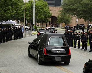 The hearse carrying the casket of former first lady Barbara Bush leaves after a funeral service for former first lady Barbara Bush at St. Martin's Episcopal Church, Saturday, April 21, 2018, in Houston. (AP Photo/Evan Vucci)