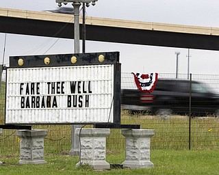 A signs honoring former first lady Barbara Bush is seen along highway 6, the route of motorcade carrying former first lady Barbara Bush, Saturday, April 21, 2018, in Hempstead, Texas. (AP Photo/Mark Humphrey)