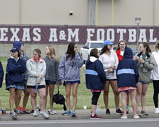 People wait for the motorcade carrying former first lady Barbara Bush Saturday, April 21, 2018, in College Station, Texas. (AP Photo/Mark Humphrey)