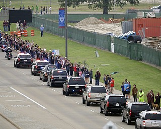 People line up to pay tribute as the motorcade carrying former first lady Barbara Bush travel through George Bush Drive, Saturday, April 21, 2018, in College Station, Texas. (AP Photo/Mark Humphrey)