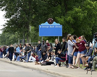 People line up to pay tribute as they wait for the motorcade carrying former first lady Barbara Bush on George Bush Drive, Saturday, April 21, 2018, in College Station, Texas. (AP Photo/Mark Humphrey)