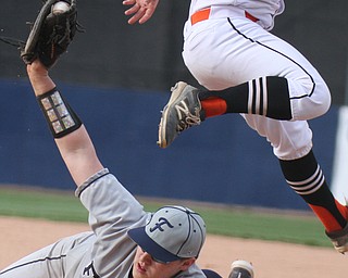 William D. Lewis The Vindicator  Fitch 1rst baseman Robby Russo(24) tags Howland's Dylan Beasom(23) during 4-23-18 action at Eastwood.