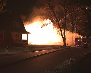 City firefighters battle the blaze at 737 Norwood Ave. at about 4 a.m. Monday morning.