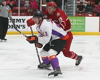 Dubuque Fighting Saints' Scott Corbett (right) and Youngstown Phantoms' Michael Callahan race to the puck during their hockey game at Mystique Community Ice Center in Dubuque on Tuesday, April 24, 2018.