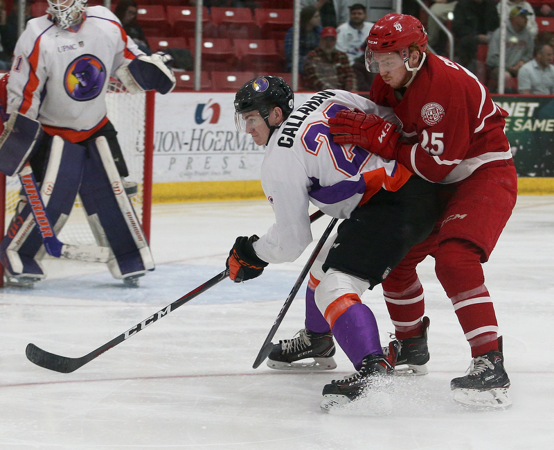 Dubuque Fighting Saints' Scott Corbett (right) and Youngstown Phantoms' Michael Callahan race to the puck during their hockey game at Mystique Community Ice Center in Dubuque on Tuesday, April 24, 2018.