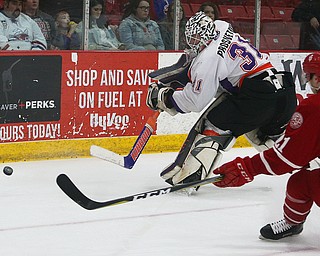 Youngstown Phantoms' goalie Ivan Prosvetov hits the puck to the corner during their hockey game against the Dubuque Fighting Saints at Mystique Community Ice Center in Dubuque on Tuesday, April 24, 2018.