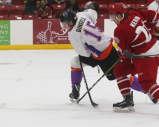 Youngstown Phantoms' Jake Gingell (left) tries to stop Dubuque Fighting Saints' Jan Kern during their hockey game at Mystique Community Ice Center in Dubuque on Tuesday, April 24, 2018.