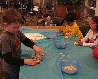 Neighbors | Zack Shively.The Austintown library had a "Marshmallow Peep Science" program on March 14, which included seven different stations relating to Peep candies, such as the building station pictured. Children used toothpicks and jellybeans create structures around Peeps.