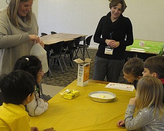 Neighbors | Zack Shively.Libraians Ashley Young and Nikki Puhalla organized the Marshmallow Peep Science program at the Austintown library. Pictured, Young poured baking soda and vinegar on a Peep to see what, if anything, would happen.