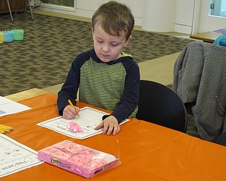 Neighbors | Zack Shively.The librarians had a program based on Peeps because Easter was nearing and Peeps are a popular Easter candy. The station from the program had the children describe the candy using their five senses.