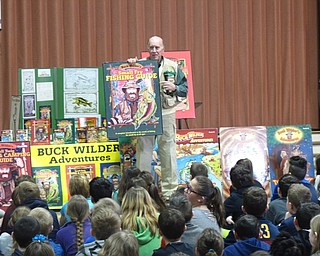 Neighbors | Zack Shively.All of Tim Smith's ten "Buck Wilder" books focus on nature, such as the book cover "Buck Wilder's Small Fry Fishing Guide" pictured. He presented in his fishing gear and talked to the children about nature.