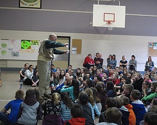 Neighbors | Zack Shively.Author Tim Smith showed the Dobbins Elementary students how to make a cup out of paper. He poured water in his cup and drank it. He said he loved paper and all of its uses.