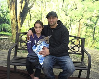 Neighbors | Zack Shively.The PTO of Dobbins Elementary organized the father daughter night. They set up a station where parents and children could get their pictures taken with a small kangaroo. Pictured are Alivia Carbone and Tony Cruz.