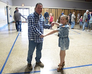 Neighbors | Zack Shively.The Dobbins Elementary father daughter night featured a dance in the gymnasium with music by DJ Bob Hlinka of Music Man DJ Services. Pictured are Bob DiFabio and his daughter Juilanna.
