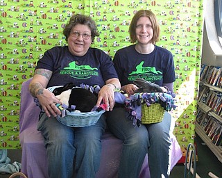 Neighbors | Zack Shively.Frisky Ferrets, Fuzzies and Feathered Friends Rescue and Sanctuary (F5RS) gave families the opportunity to take photos with their trained therapy rabbits at Family Video. Pictured are F5RS volunteers Sassy Pickard and Barb Ricker. The organization provides homes for rescued animals as well as community outreach with their trained rabbits.