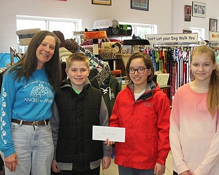 Neighbors | Abby Slanker.Canfield Village Middle School Ambitious Citizens for Empathy Charity Committee members, from second on left, Matthew Logan, A.J. Helmick and Emily Heino presented a donation of $500.84 to Diane Less, co-founder of Angels for Animals, on March 31. Missing from photo is committee member Anna Kerns.
