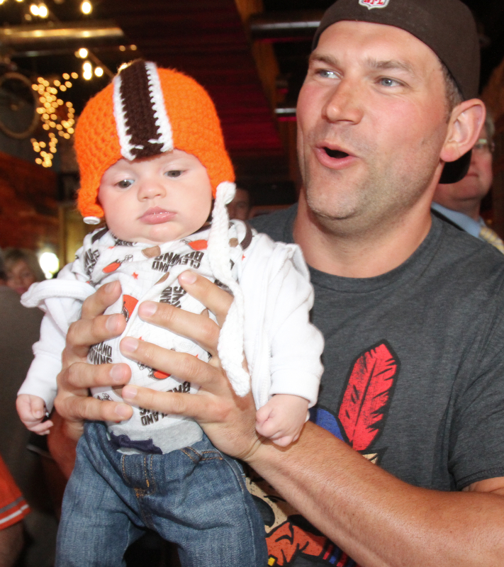 William D. Lewis The Vindicator Haden Holmes, 13 weeks, meets former Browns player Joe Thomas,  during draft night event at Suzies Dogs and Drafts in Boardman. Haden is a son of Matt and Samantha Holmes of Austintown.