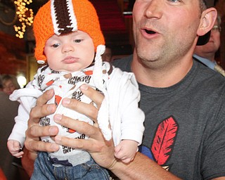 William D. Lewis The Vindicator Haden Holmes, 13 weeks, meets former Browns player Joe Thomas,  during draft night event at Suzies Dogs and Drafts in Boardman. Haden is a son of Matt and Samantha Holmes of Austintown.