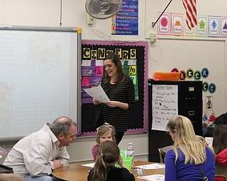 Neighbors | Abby Slanker.C.H. Campbell Elementary School first-grade teacher Alyssa Carbon read a poem to first-graders and their families during the school’s Literacy Night on April 11.