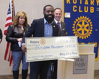 Neighbors | Zack Shively.Each of the organizations at the Awards Breakfast took a picture with a check and received their organization's check from the Rotary members. Pictured is Germaine McAlpine of the Boys and Girls Club of Youngstown. The organization will use the funds for projects in Youngstown city schools.