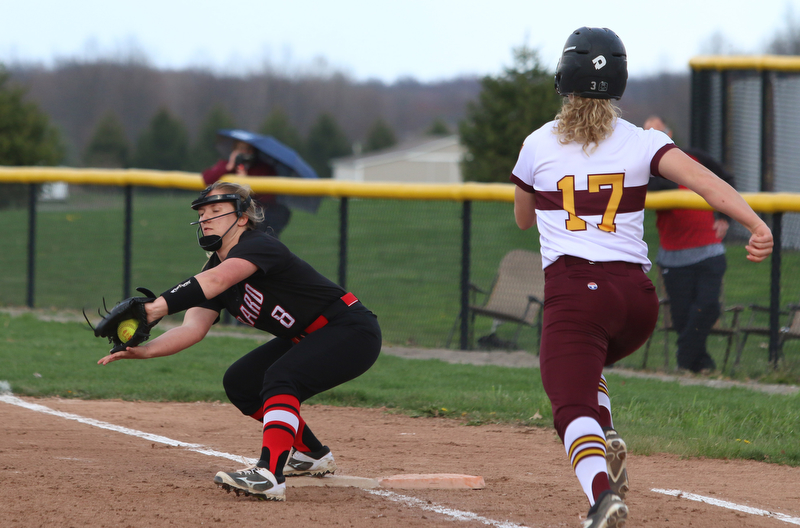 Girards Emma Markulin (8) catches a ball at first base to force out South Range's Bree Kohler (17) during Friday afternoons game at South Range.  Dustin Livesay  |  The Vindicator  4/27/17 South Range High School.