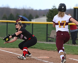 Girards Emma Markulin (8) catches a ball at first base to force out South Range's Bree Kohler (17) during Friday afternoons game at South Range.  Dustin Livesay  |  The Vindicator  4/27/17 South Range High School.