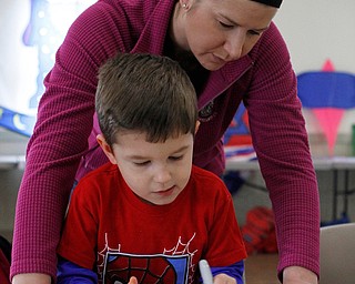 Evan Porter (3) colors his kite with his mom Kim Porter of Canfield during the Kite Festiival at the Mill Creek Metro Parks Farm in Canfield on Saturday morning.  

4/28/18

Dustin Livesay  |  The Vindicator  

Mill Creek Park