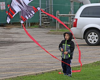 Isaak Blackburn (5) of Youngstown stands in awe as a kite flies past him during the Kite Festiival at the Mill Creek Metro Parks Farm in Canfield on Saturday morning.  

4/28/18

Dustin Livesay  |  The Vindicator  

Mill Creek Park