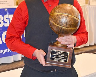 Nate Solak, from Lowellville High School, holds his Curbstone Coaches Byrd Giampetro Student Athlete of the Year award at the Curbstone Coaches Basketball Recognition Banquet at the Our Lady of Mount Carmel Social Hall in Youngstown on Sunday, April 29, 2018.  

Photo by Scott R. Williams - The Vindicator