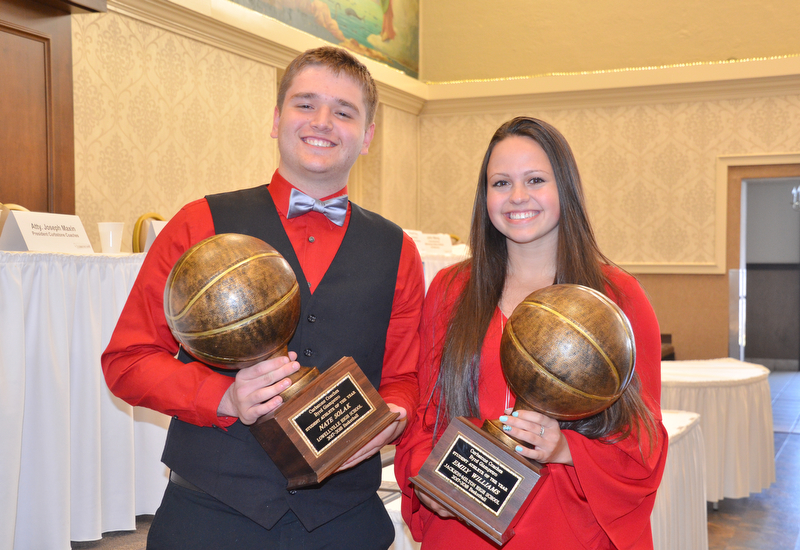 Nate Solak, from Lowellville High School, (left) and Emily Williams, from Jackson-Milton High School, hold their Curbstone Coaches Byrd Giampetro Student Athlete of the Year awards at the Curbstone Coaches Basketball Recognition Banquet at the Our Lady of Mount Carmel Social Hall in Youngstown on Sunday, April 29, 2018.  

Photo by Scott R. Williams - The Vindicator