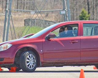 Dillon Burnside, 16, from Kensington, OH, navigates a fast pace skid control exercise, and plows over some cones, at a TireRack.com Street Survival School event at Boardman Park on Sunday, April 29, 2018.  

Photo by Scott R. Williams - The Vindicator