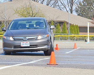 Alia Sater, 15, from Columbus, OH, navigates a fast pace skid control exercise, and plows over some cones, at a TireRack.com Street Survival School event at Boardman Park on Sunday, April 29, 2018.  

Photo by Scott R. Williams - The Vindicator.