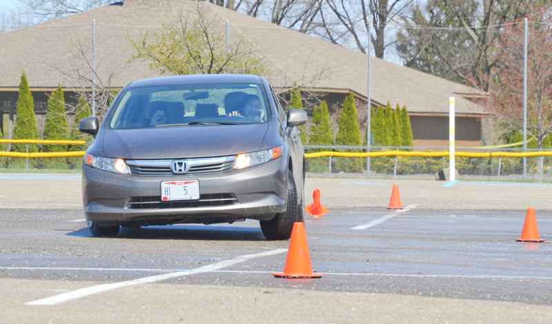 Alia Sater, 15, from Columbus, OH, navigates a fast pace skid control exercise, and plows over some cones, at a TireRack.com Street Survival School event at Boardman Park on Sunday, April 29, 2018.  

Photo by Scott R. Williams - The Vindicator