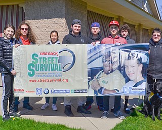 Participants of a TireRack.com Street Survival School take a class photo at the end of their event at Boardman Park on Sunday, April 29, 2018.  From left to right, they are Hayley Ward, Mars, PA; Liam Martin, Canfield, OH; Alia Sater, Columbus, OH; Brandon Carryer, Pittsburgh; Nic Mahan, Warren, OH; Kyle Kashbienski, Elyria, OH; Dillon Burnside, Kensington, OH; and Wendy Setterberg, Masury, OH. 

Photo by Scott R. Williams - The Vindicator