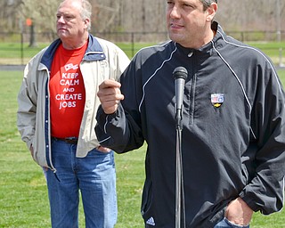 Congressman Tim Ryan, right, addresses a packed set of bleachers at a rally to keep TJX in the Mahoning Valley on Sunday, April 29, 2018 at the Lordstown High School track. In the back, wearing his "Keep Calm and Create Jobs" teeshirt is Lordstown Mayor Arno Hill. 

Photo by Scott R. Williams - The Vindicator 