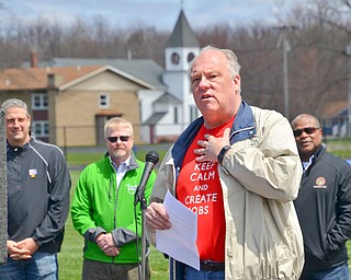 Lordstown Mayor Arno Hill, wearing his "Keep Calm and Create Jobs" teeshirt, addresses a packed set of bleachers at a rally to keep TJX in the Mahoning Valley on Sunday, April 29, 2018 at the Lordstown High School track. In the background are, from left to right, U.S. Congressman Tim Ryan, Ohio State Senator Sean O'Brien, and Warren Mayor William D. Franklin.  

Photo by Scott R. Williams - The Vindicator
