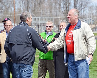 Lordstown Mayor Arno Hill, right, shakes the hand of Congressman Tim Ryan, thanking him for his support at a rally to keep TJX in the Mahoning Valley on Sunday, April 29, 2018 at the Lordstown High School track. 

 Photo by Scott R. Williams - The Vindicator