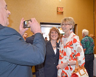 Steve DeGenaro takes a photo of his wife, Ohio Supreme Court Justice Mary DeGenaro (right) and Kathleen Bartlett, 7th District Court of Appeals, prior to the start of the Mahoning County Republican Party's Annual Abraham Lincoln Day Dinner held at The Maronite Center on Tuesday, May 1, 2018.  

Photo by Scott Williams - The Vindicator