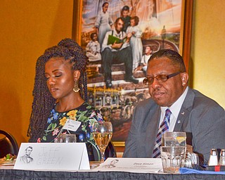 Arielle Green, left, and her father Jeff Green bow their heads in prayer at the Mahoning County Republican Party's Annual Abraham Lincoln Day Dinner held at The Maronite Center on Tuesday, May 1, 2018.  Looming in the background is local artist Ray Simon's painting of Abraham Lincoln, which is a permanent fixture at the Abraham Lincoln Presidential Library.   

Photo by Scott Williams - The Vindicator