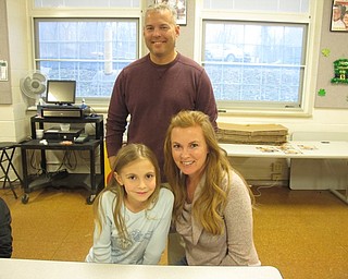 Neighbors | Zack Shively.Families went to the cafeteria in Union Elementary during the math night for a fraction lesson. They drew fractions on a pizza box while enjoying pizza. Pictured are Michelle and Josh Izenour and their daughter Ella.