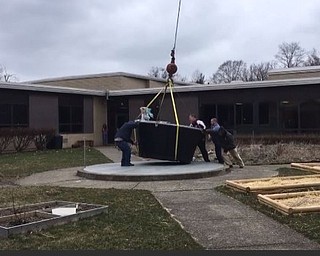 Neighbors | Submitted .Diamond Steel workers helped place the composter for Boardman Glenwood Junior High School.