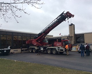 Neighbors | Submitted.Diamond Steel donated a crane to help the students and staff at Boardman Glenwood hoist a composter tub over the school building and into the courtyard.