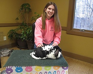 Neighbors | Zack Shively.The Evening with the Easter Bunny allowed families to come to Boardmna Park and celebrate the holiday with fun activities. Pictured, Nicole D'Angelo brought her rabbit Oreo to the event for children to pet and take pictures with.