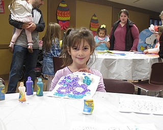 Neighbors | Zack Shively.The park set up a number of crafts and photo opportunities in the activities room of the Lariccia Family Community Center for their Easter event. Pictured, Anna worked on a piece of art at one of the craft tables.