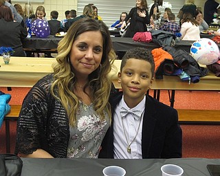 Neighbors | Zack Shively.Austintown Intermediate School had a special night for the mothers and students of the school. The night included a dance, dinner and a photo booth. Pictured are Maribeth DeMain and her son Mikhi at the event.