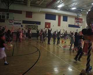 Neighbors | Zack Shively.The AIS PTA decorated the gym for the event with balloons and stars. They also brought in Melton Entertainment, which provided a DJ, lights, speakers and a fog machine.