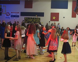 Neighbors | Zack Shively.The mother and child dance was the first of its kind for AIS. The event sold out and had 500 people in attendance. The PTA and principal Michael Sauner were excited about the event and would like to see it become an annual program for the school.