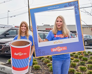 Julie Bowser (left) and Georgia Fowkes attempt to energize the crowd at the grand-opening ceremony of the new GetGo gas station/cafe/market at 133 Boardman-Poland Road in Boardman on Thursday May 3, 2018. 

 Photo by Scott Williams - The Vindicator